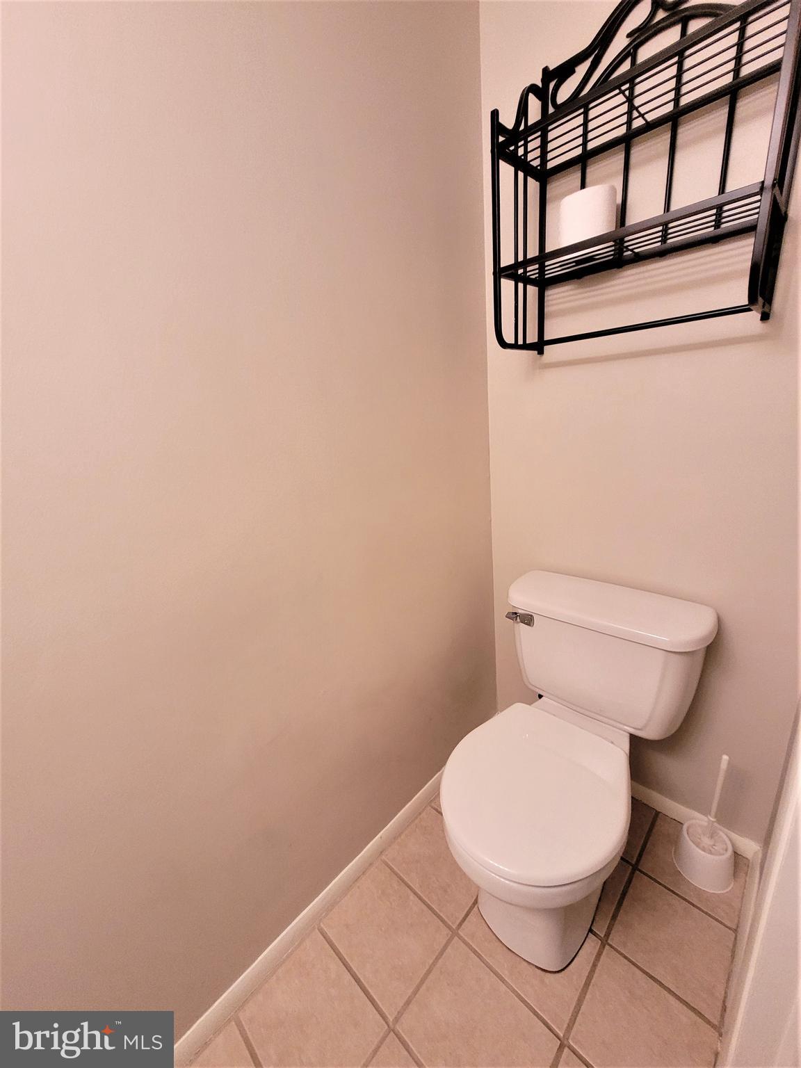 8072 Grandview Court Springfield, VA 22153 - Photo 26 of 32 a white toilet sitting next to a white wall