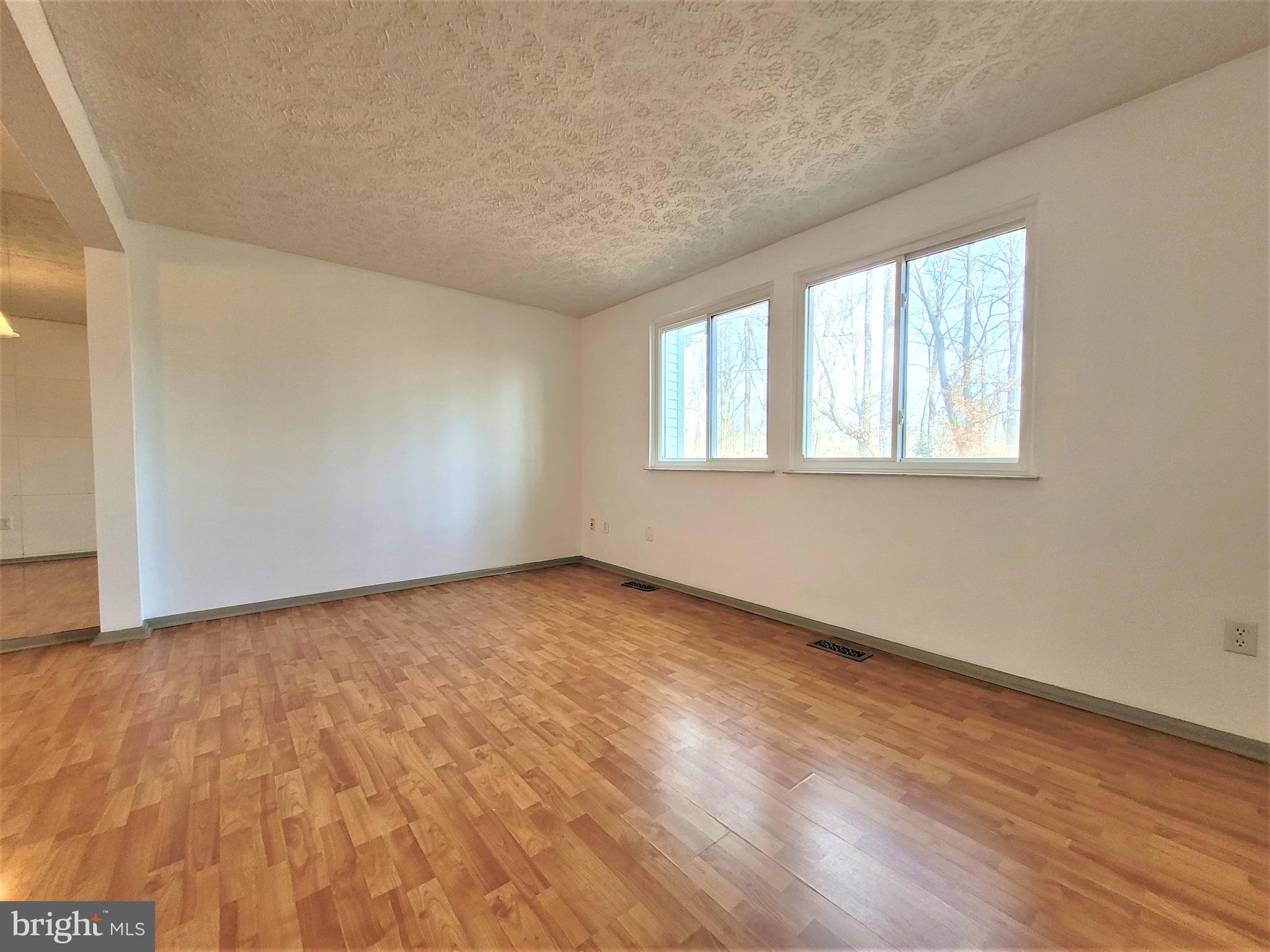 8072 Grandview Court Springfield, VA 22153 - Photo 7 of 32 wooden floor in an empty room with a window