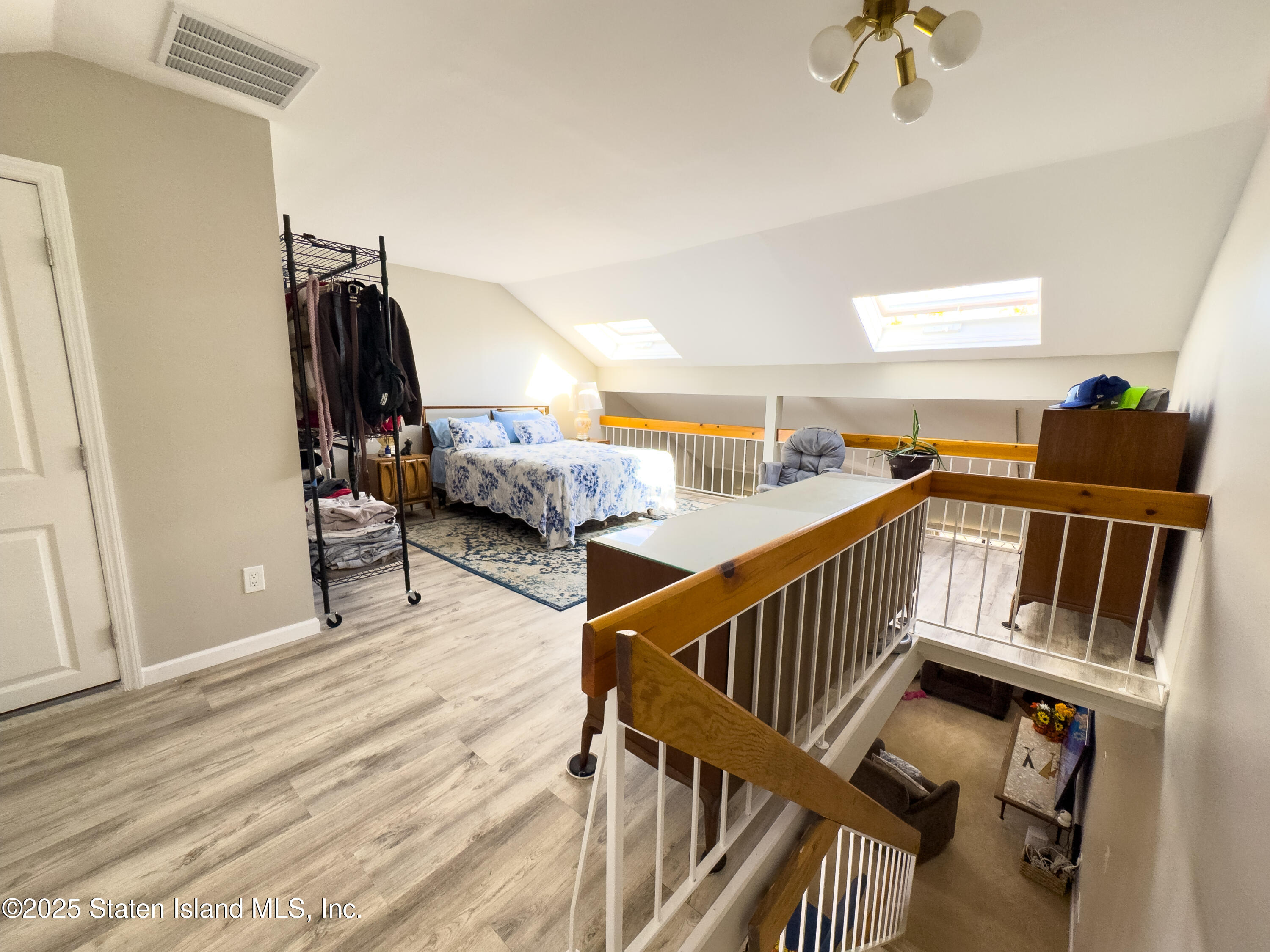 280 Rolling Hill Green Staten Island, NY 10312 - Photo 11 of 22 a view of an wooden floor and staircase