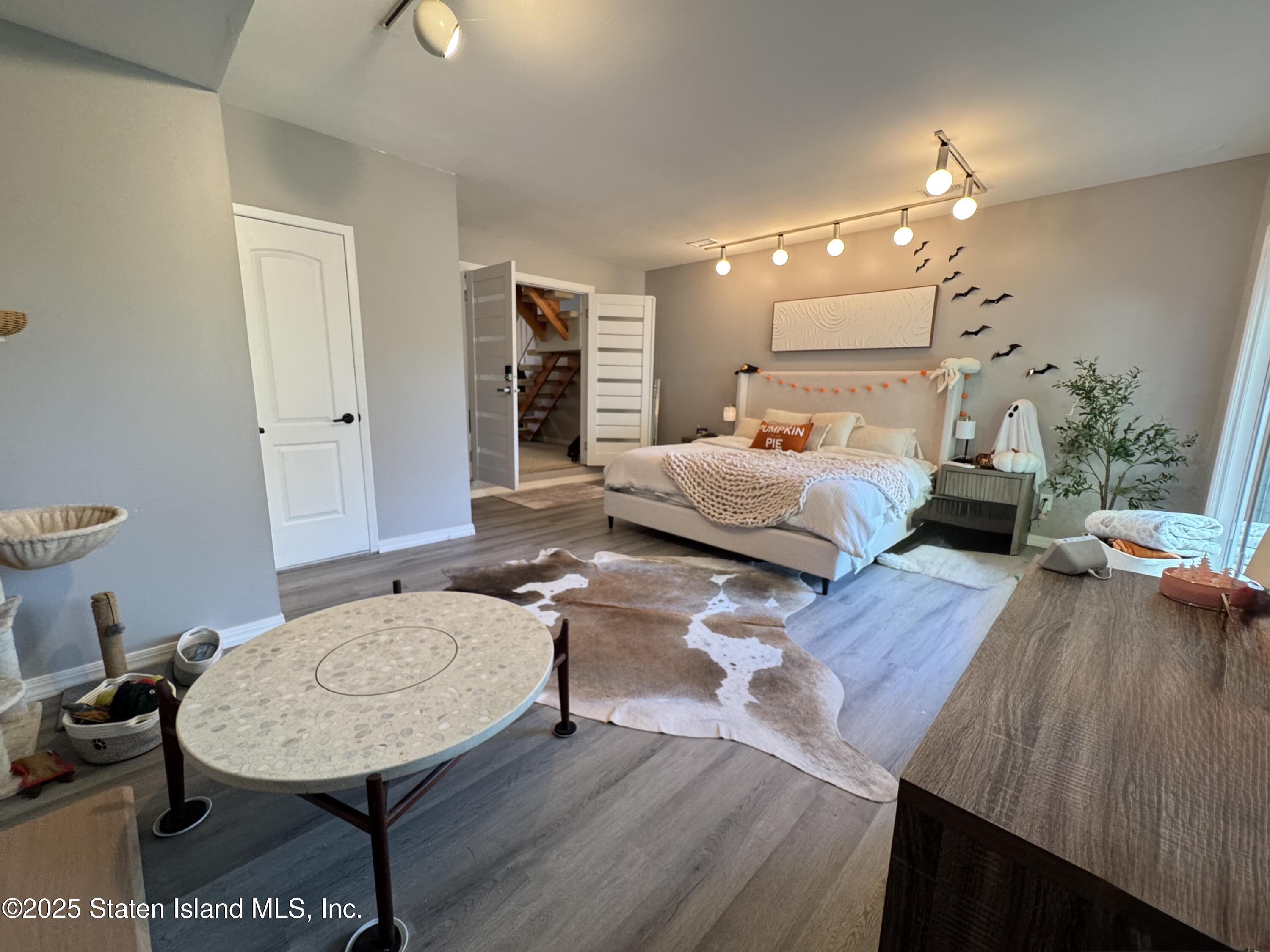 280 Rolling Hill Green Staten Island, NY 10312 - Photo 17 of 22 a living room with furniture and a wooden floor