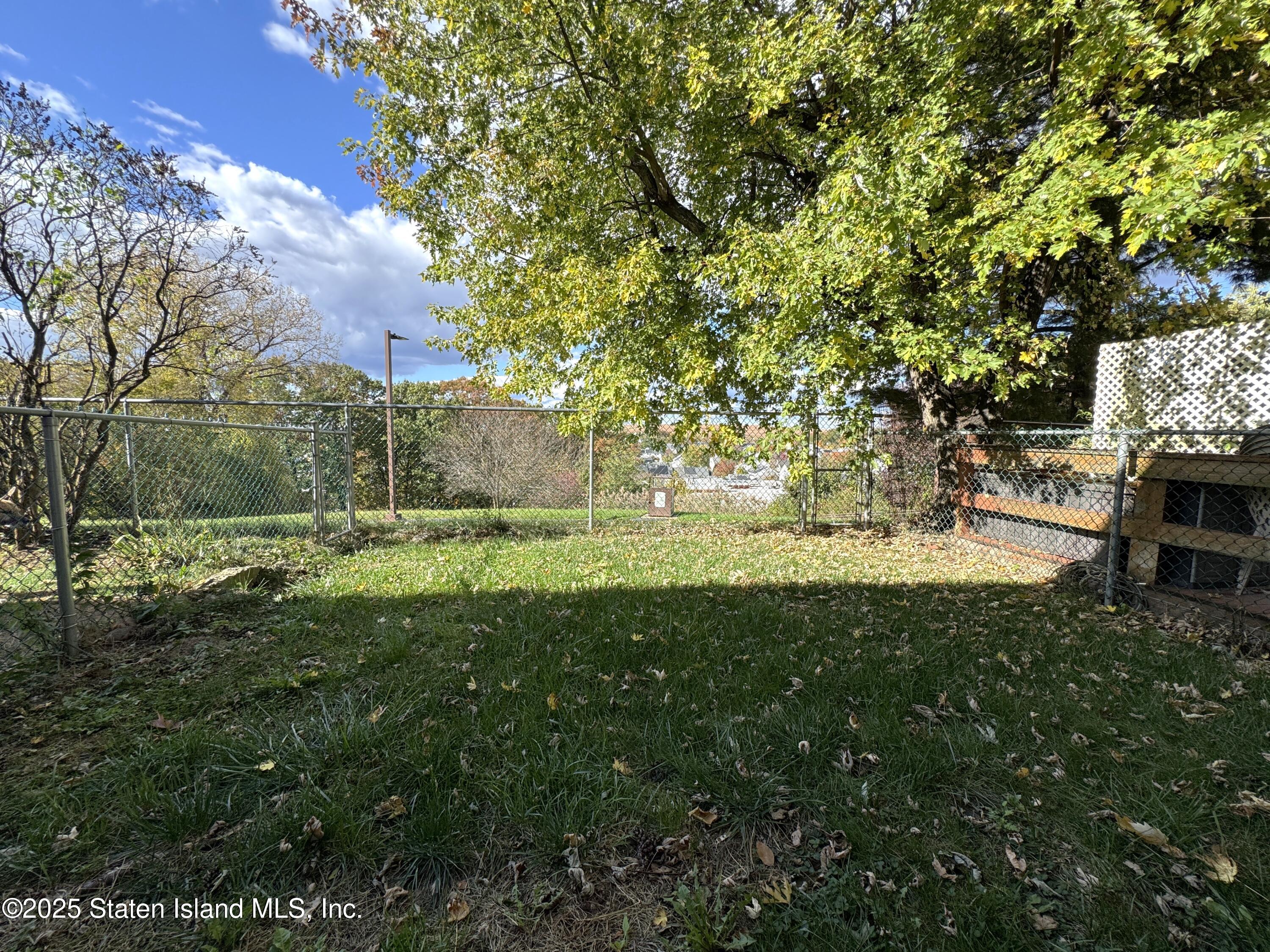 280 Rolling Hill Green Staten Island, NY 10312 - Photo 19 of 22 a huge green field with lots of bushes