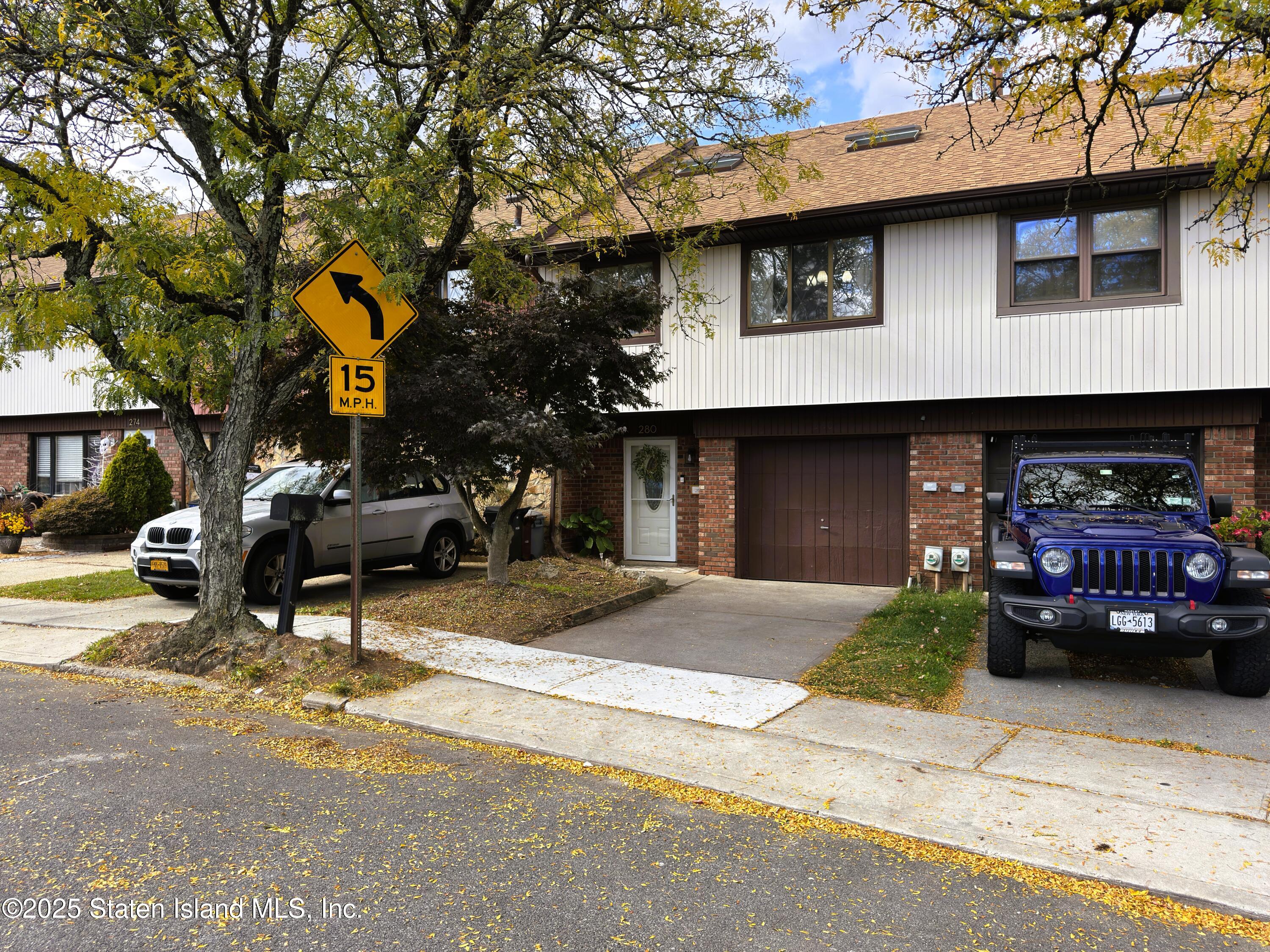 280 Rolling Hill Green Staten Island, NY 10312 - Photo 2 of 22 a view of a car park in front of house