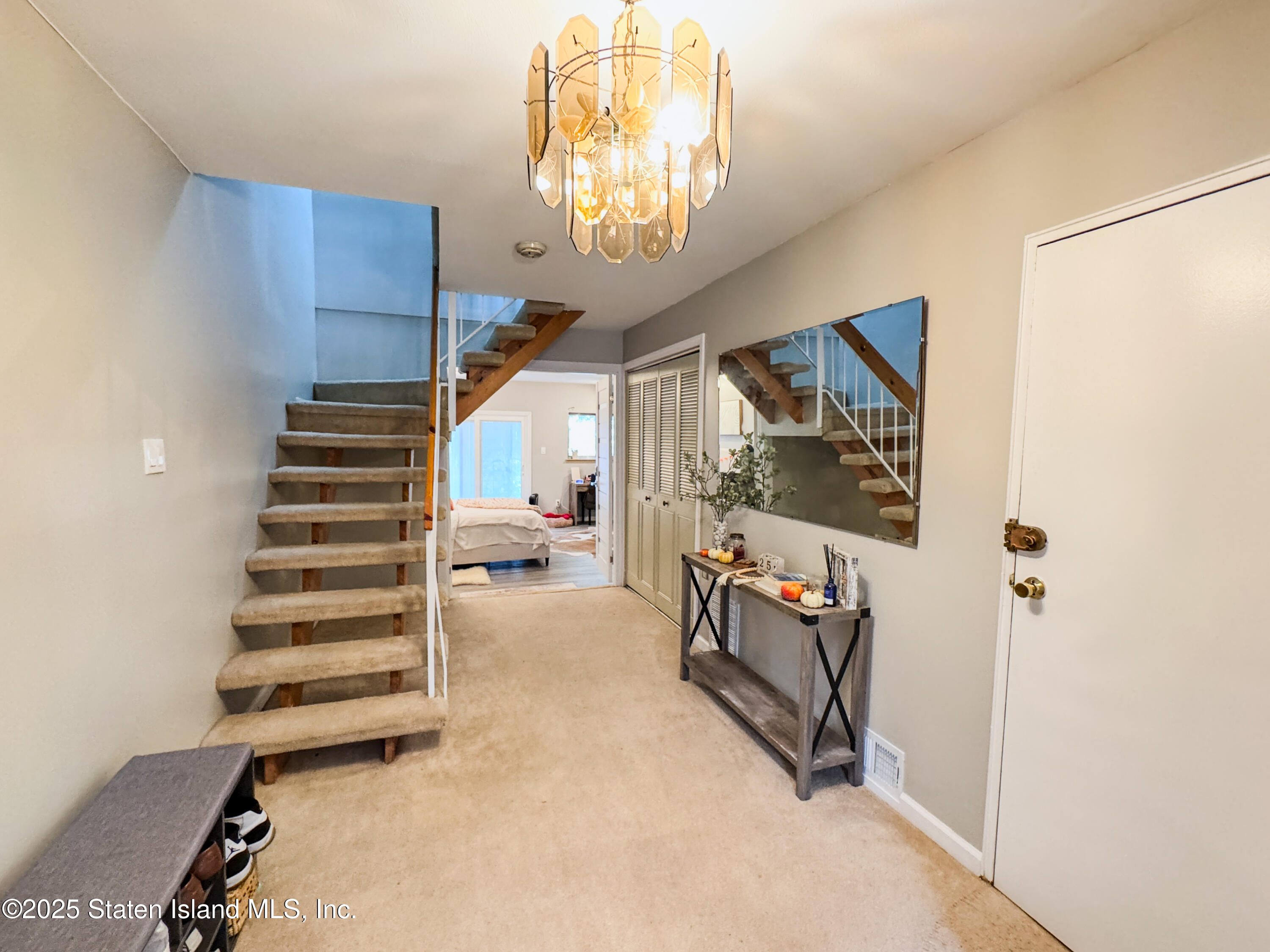 280 Rolling Hill Green Staten Island, NY 10312 - Photo 5 of 22 a view of entryway with livingroom and stairs