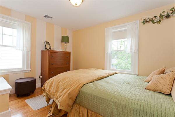 82 Cutter Hill Road Arlington, MA 02474 - Photo 13 of 14 a bedroom with a bed and wooden floor