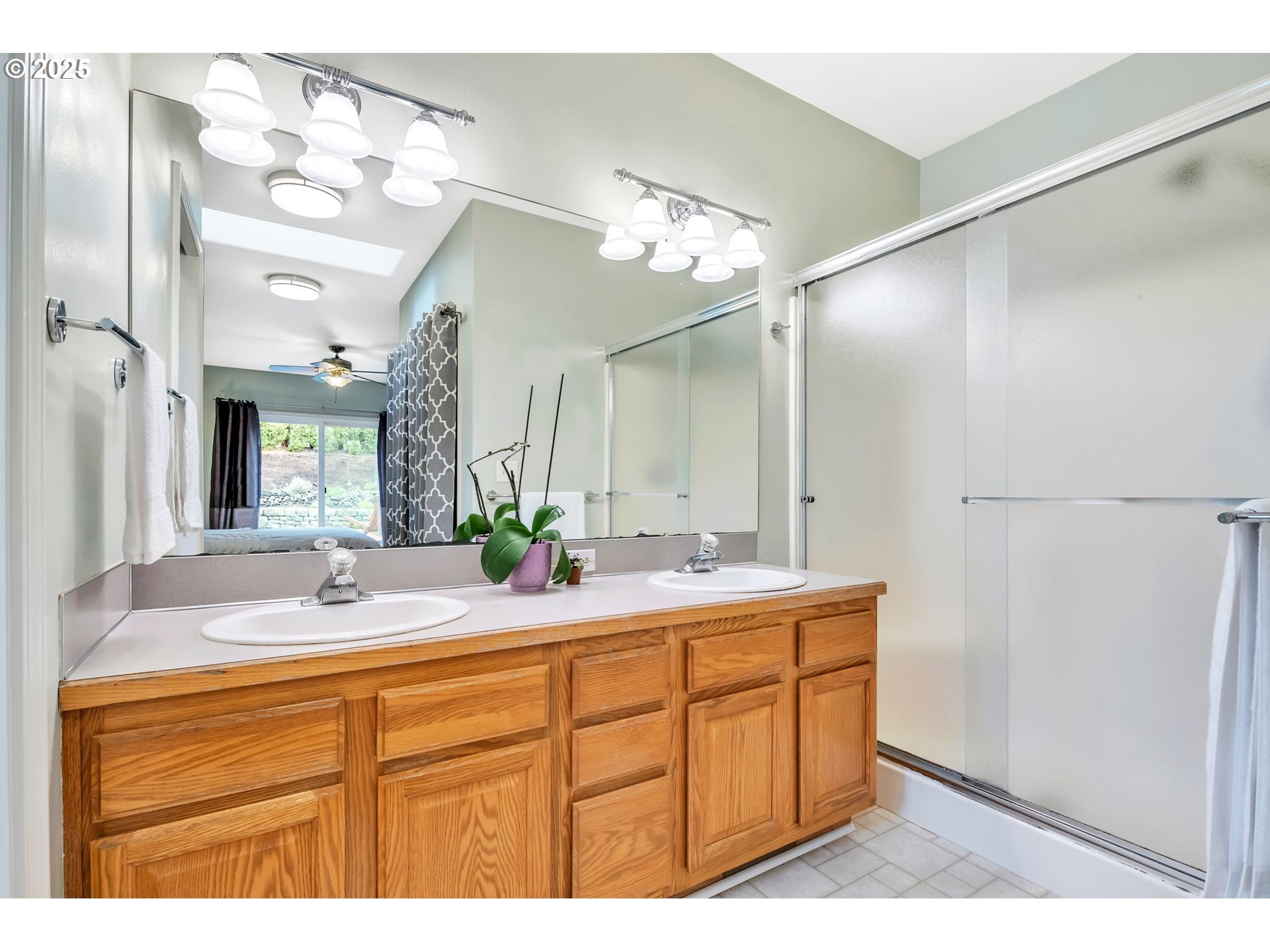 1750 Ridgley Boulevard Eugene, OR 97401 - Photo 14 of 26 a bathroom with a sink double vanity granite and a mirror