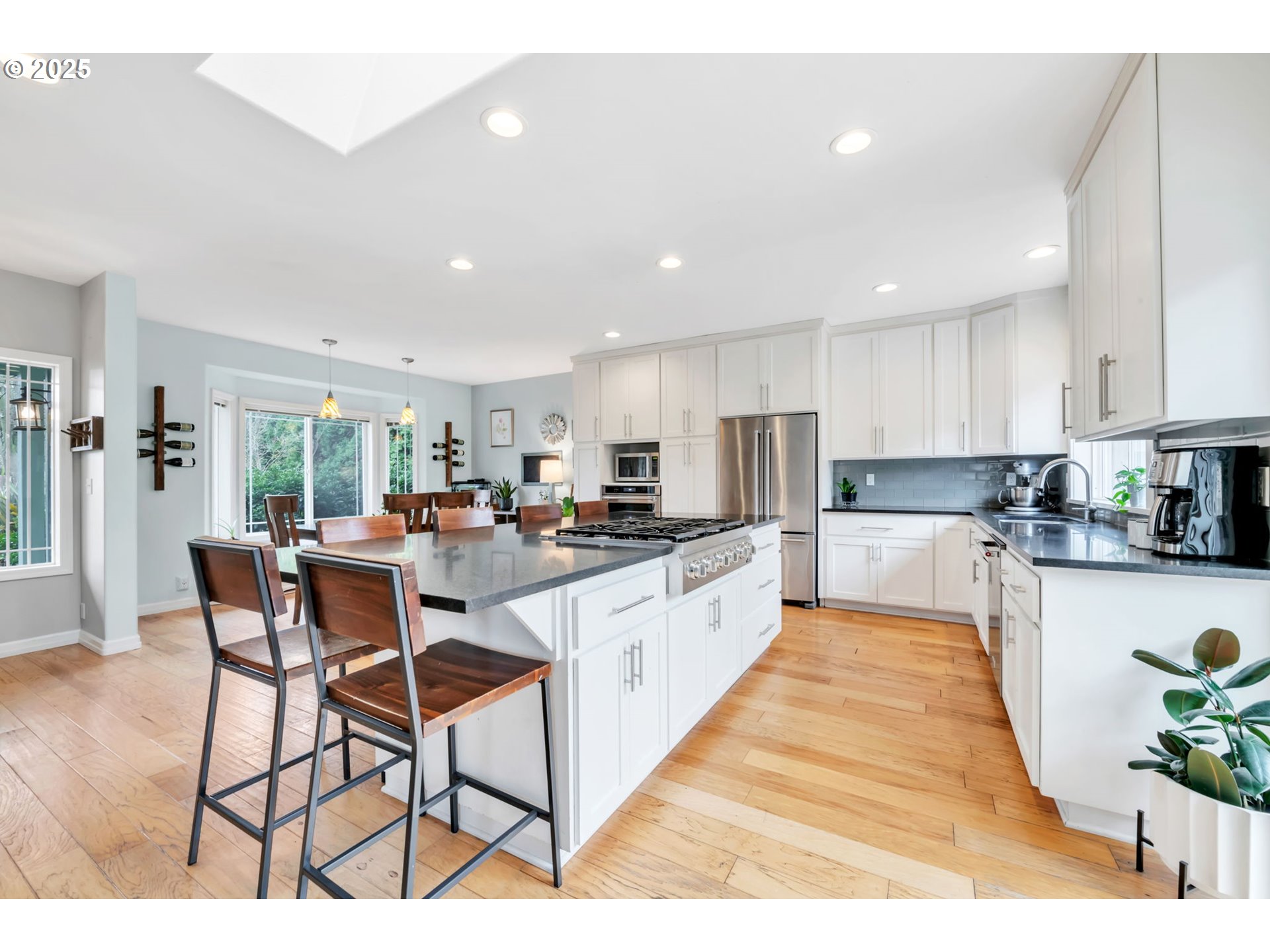 1750 Ridgley Boulevard Eugene, OR 97401 - Photo 5 of 26 a large white kitchen with lots of counter top space and stainless steel appliances