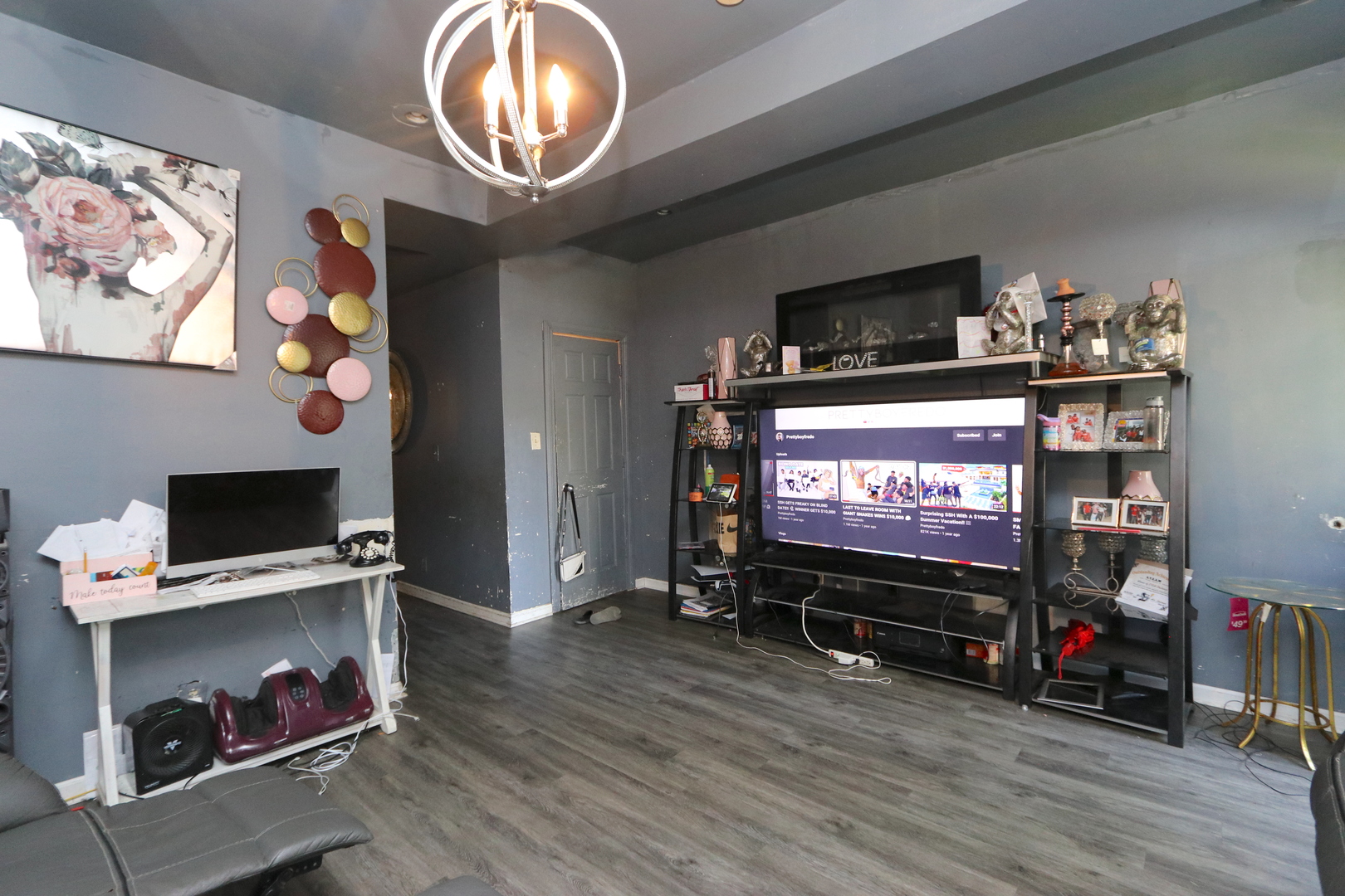 727 North Springfield Avenue Chicago, IL 60624 - Photo 11 of 22 a room with furniture and a flat screen tv