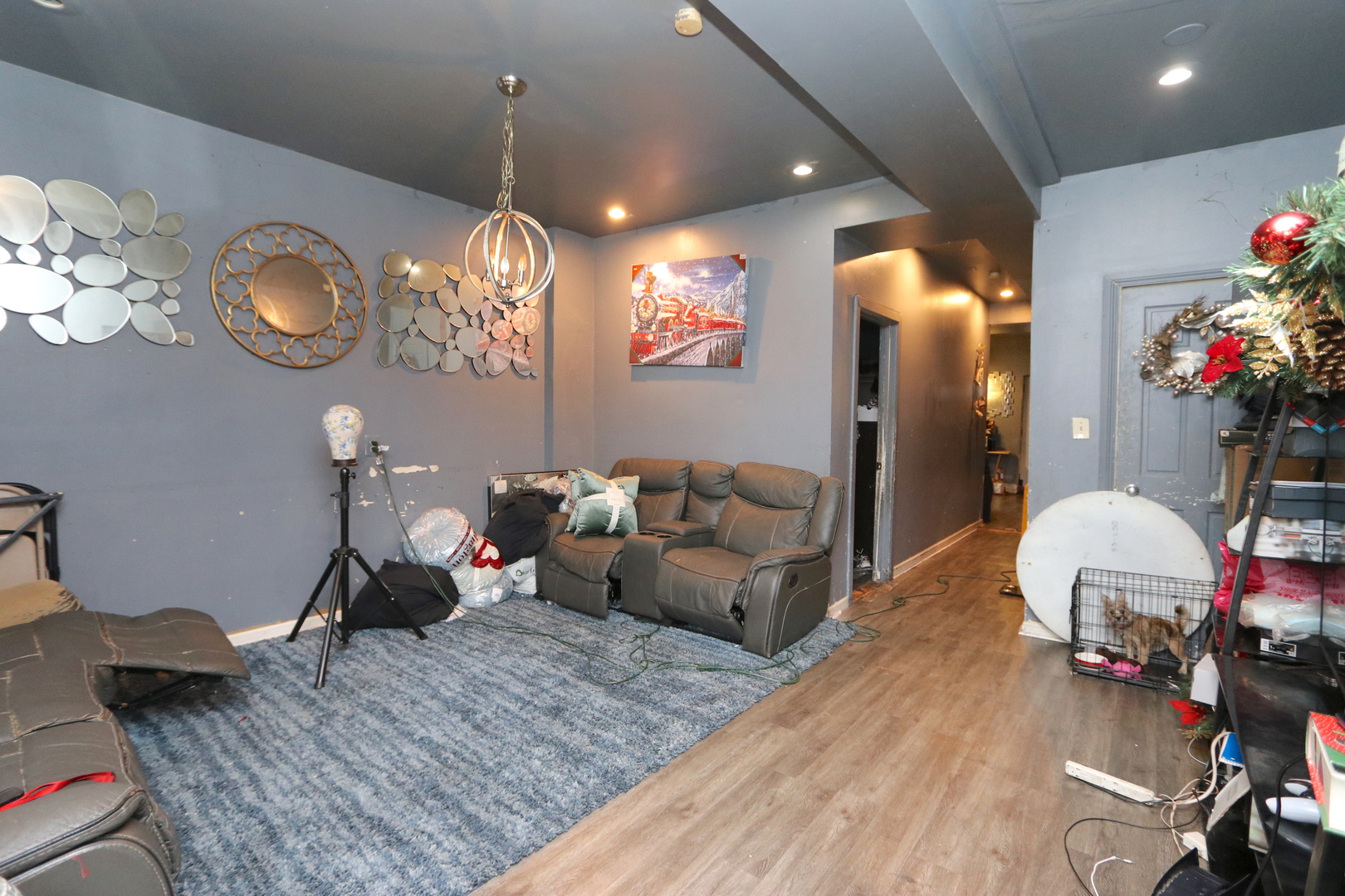 727 North Springfield Avenue Chicago, IL 60624 - Photo 15 of 22 a living room with furniture and a chandelier