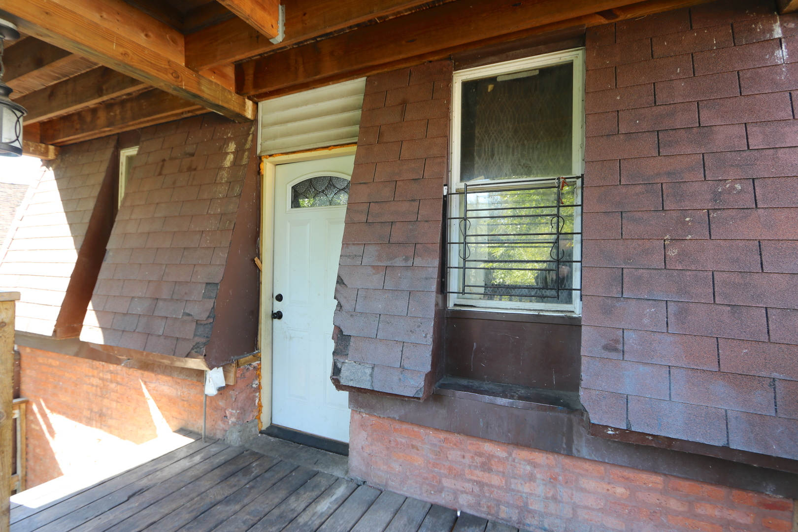 727 North Springfield Avenue Chicago, IL 60624 - Photo 19 of 22 a view of front door of house with wooden floor and a yard