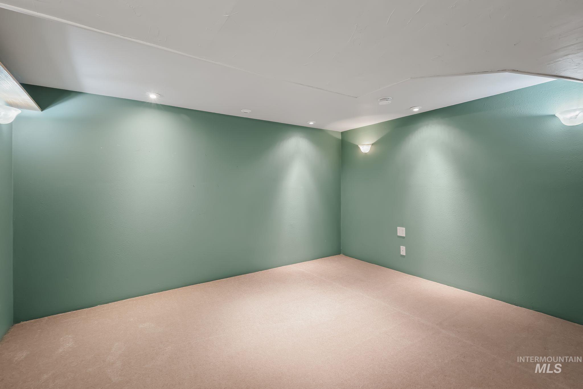 420 4th Street Lewiston, ID 83501 - Photo 26 of 38 Recessed lighting, wall sconces, ceiling-mounted light fixtures, textured ceiling, and carpeted flooring