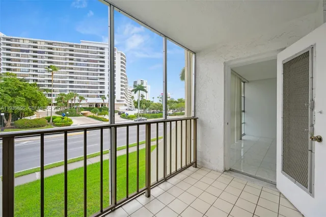 a view of a balcony with wooden floor