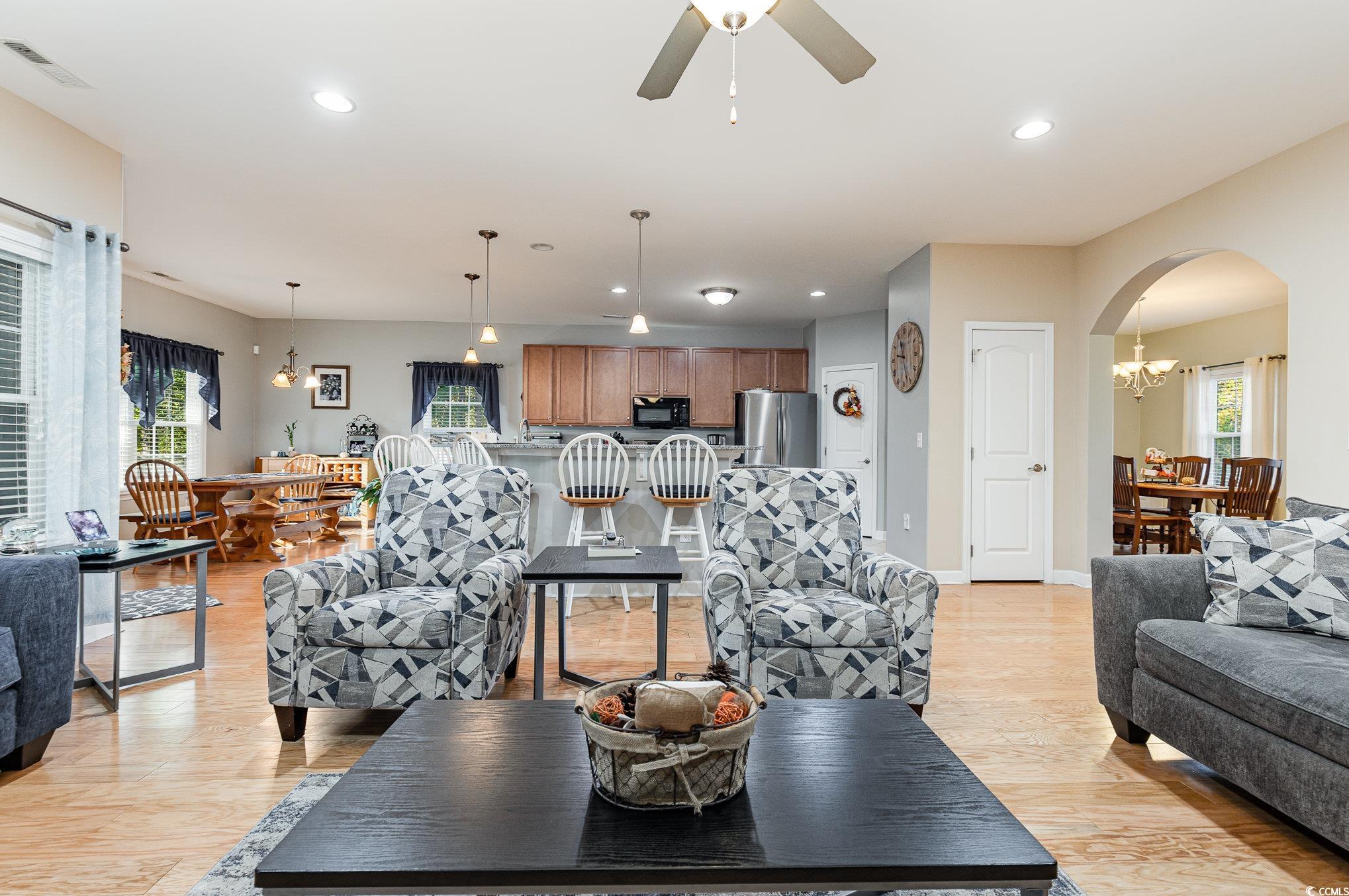 281 Marsh Tacky Loop Myrtle Beach, SC 29588 - Photo 11 of 39 Living room with light hardwood / wood-style floor