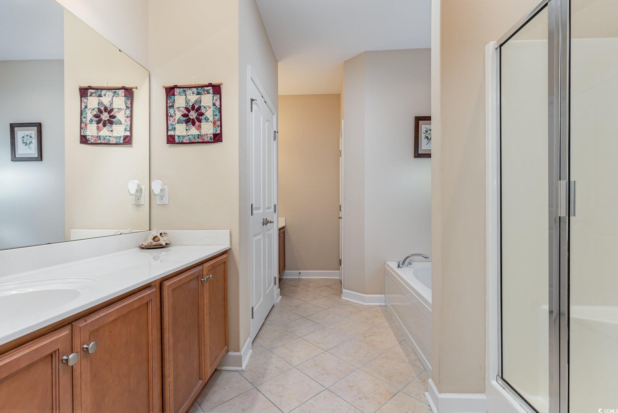 281 Marsh Tacky Loop Myrtle Beach, SC 29588 - Photo 18 of 39 Bathroom with vanity, independent shower and bath,