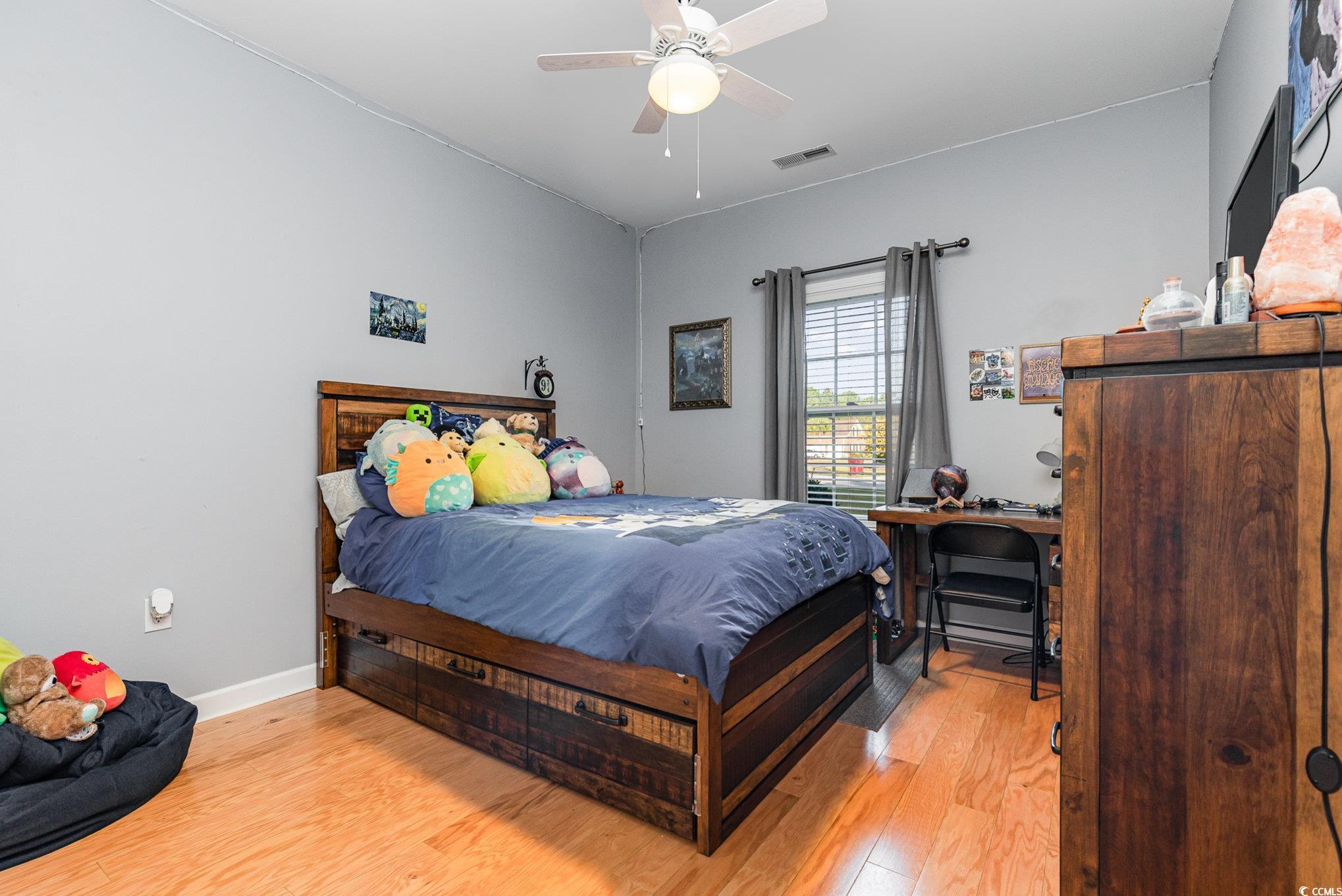 281 Marsh Tacky Loop Myrtle Beach, SC 29588 - Photo 20 of 39 Bedroom with light wood-type flooring and ceiling