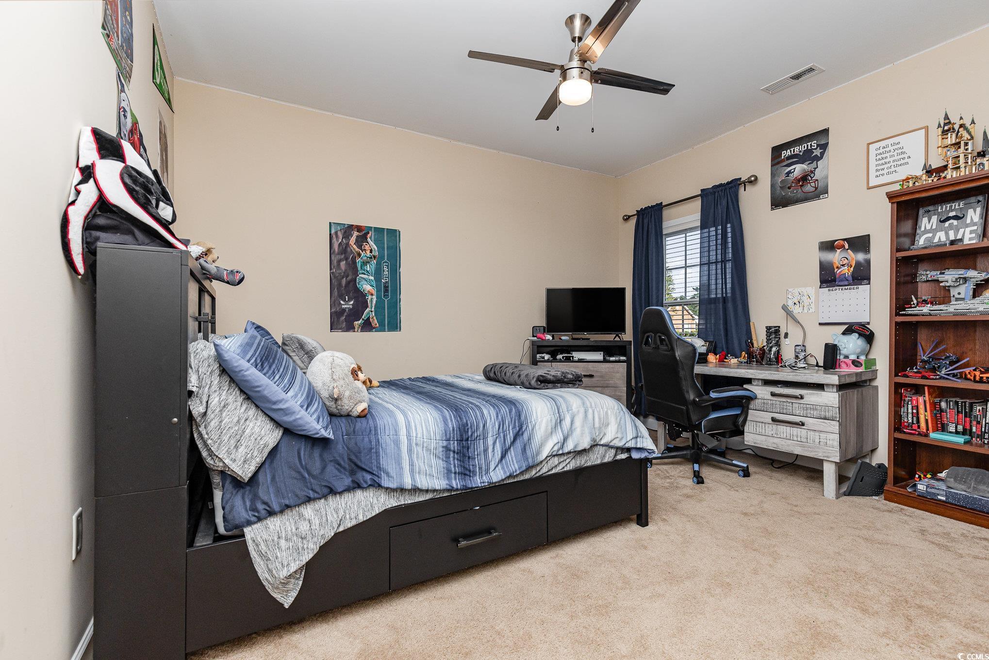 281 Marsh Tacky Loop Myrtle Beach, SC 29588 - Photo 21 of 39 Bedroom with light carpet and ceiling fan