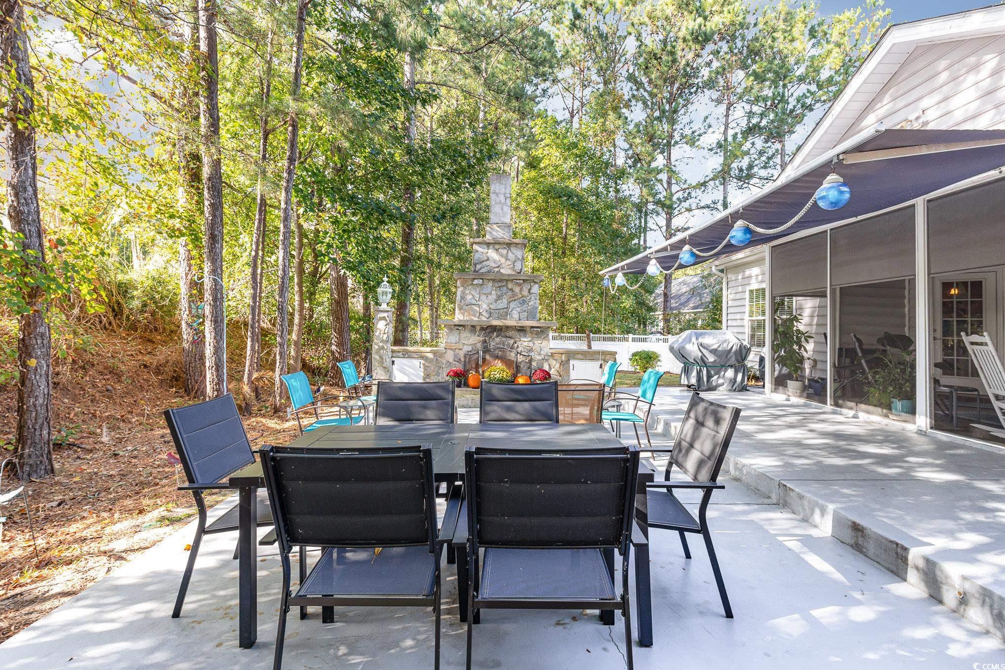 281 Marsh Tacky Loop Myrtle Beach, SC 29588 - Photo 27 of 39 View of patio with an outdoor stone fireplace