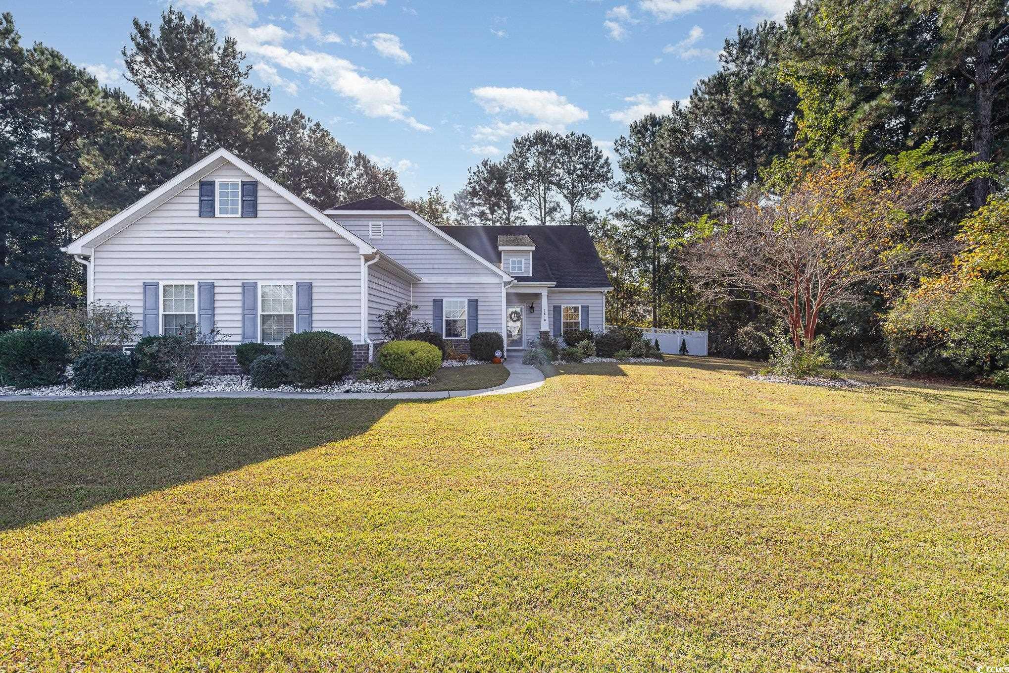 281 Marsh Tacky Loop Myrtle Beach, SC 29588 - Photo 32 of 39 Front facade featuring a front lawn