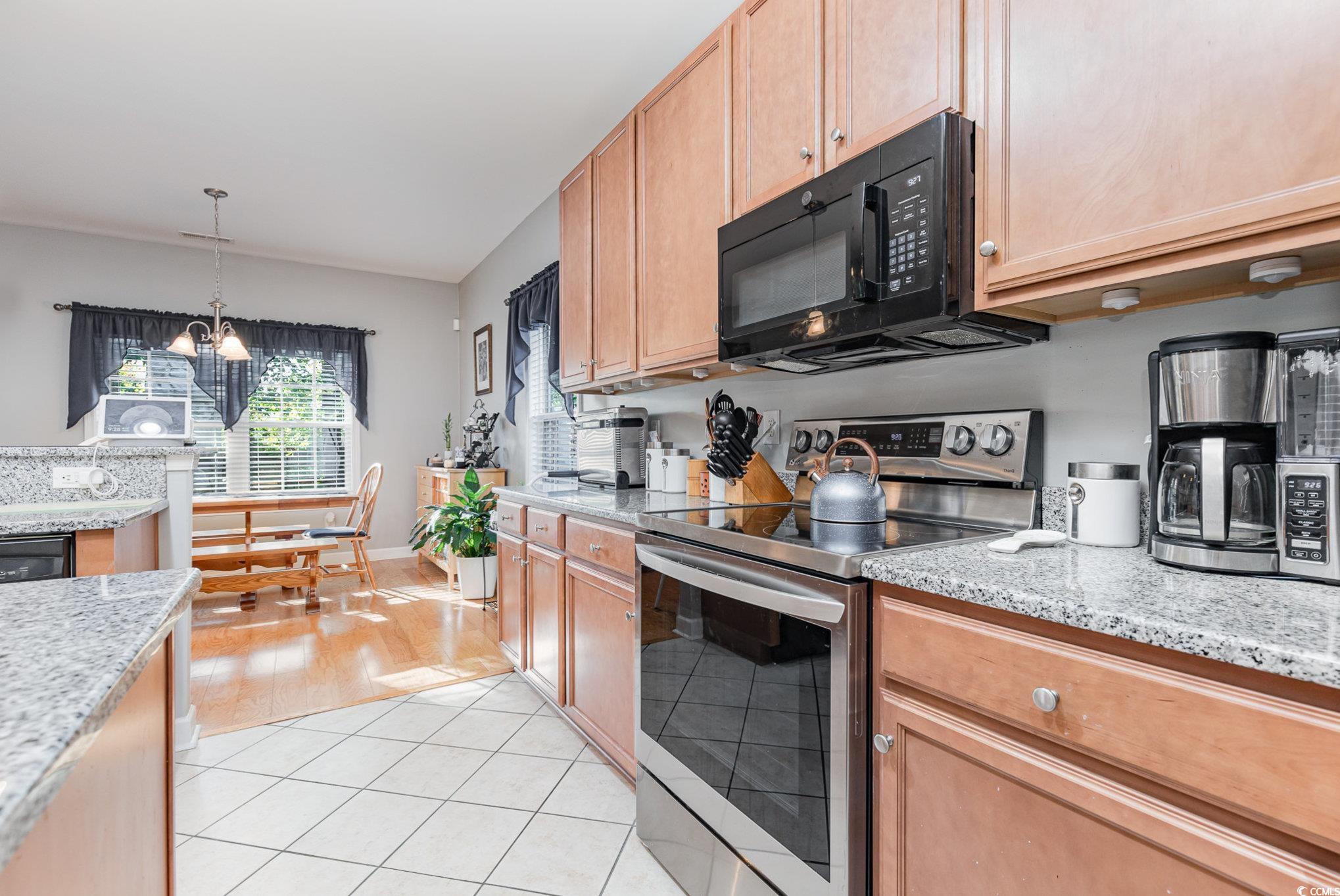 281 Marsh Tacky Loop Myrtle Beach, SC 29588 - Photo 8 of 39 Kitchen with light stone countertops, stainless st