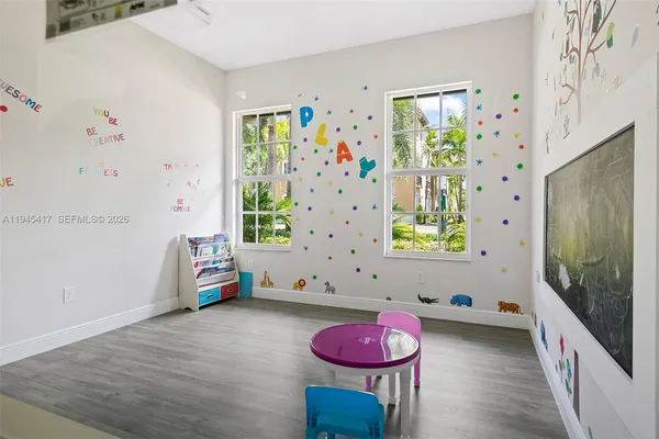a bath room with a couch and a potted plant