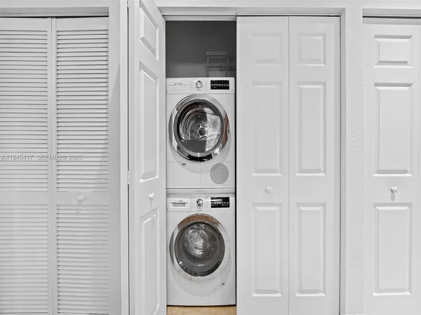 a view of a storage & utility room with washer and dryer