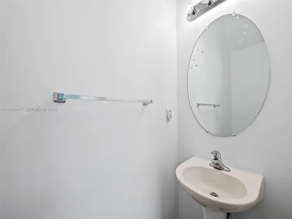 a bathroom with a sink and mirror