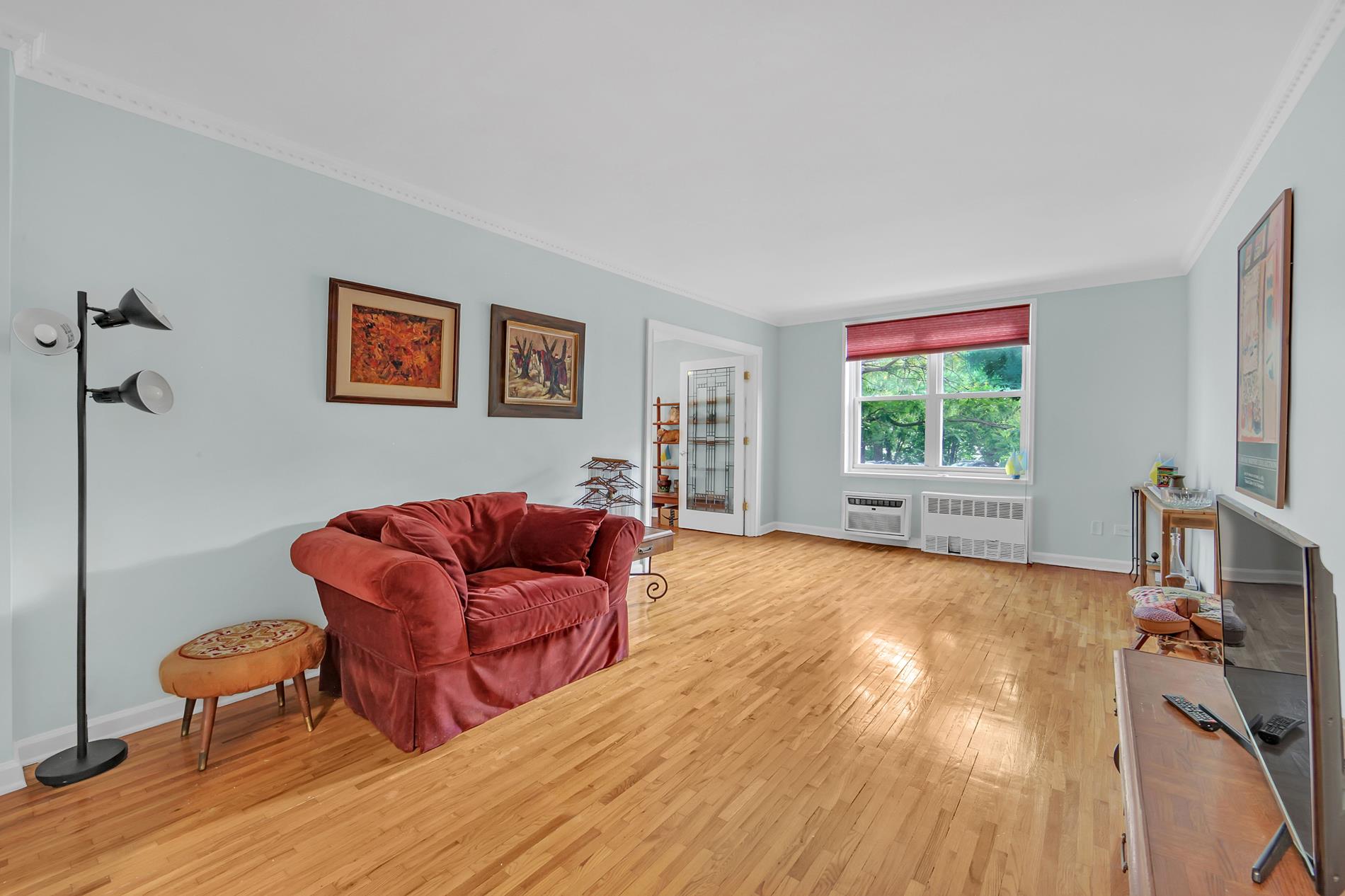 9411 Shore Road, Unit 1O Brooklyn, NY 11209 - Photo 13 of 19 a living room with furniture and a wooden floor