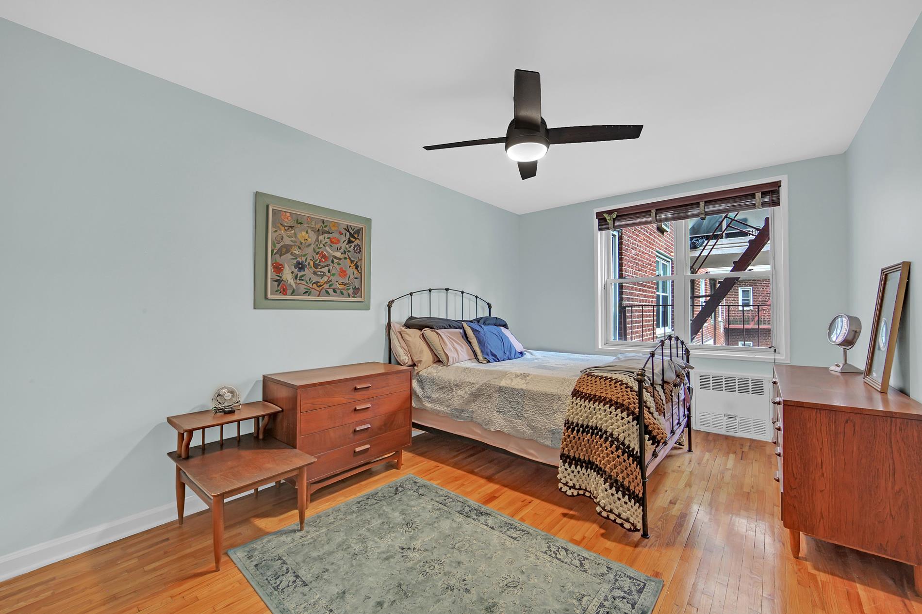9411 Shore Road, Unit 1O Brooklyn, NY 11209 - Photo 14 of 18 a bedroom with furniture and a window