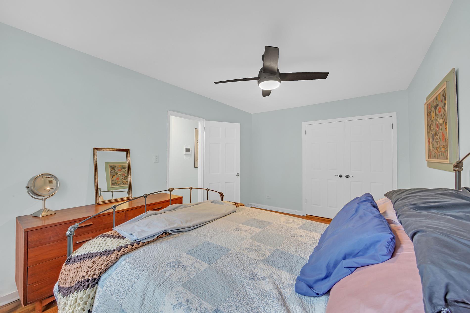 9411 Shore Road, Unit 1O Brooklyn, NY 11209 - Photo 16 of 19 a bedroom with a bed and painting on the wall