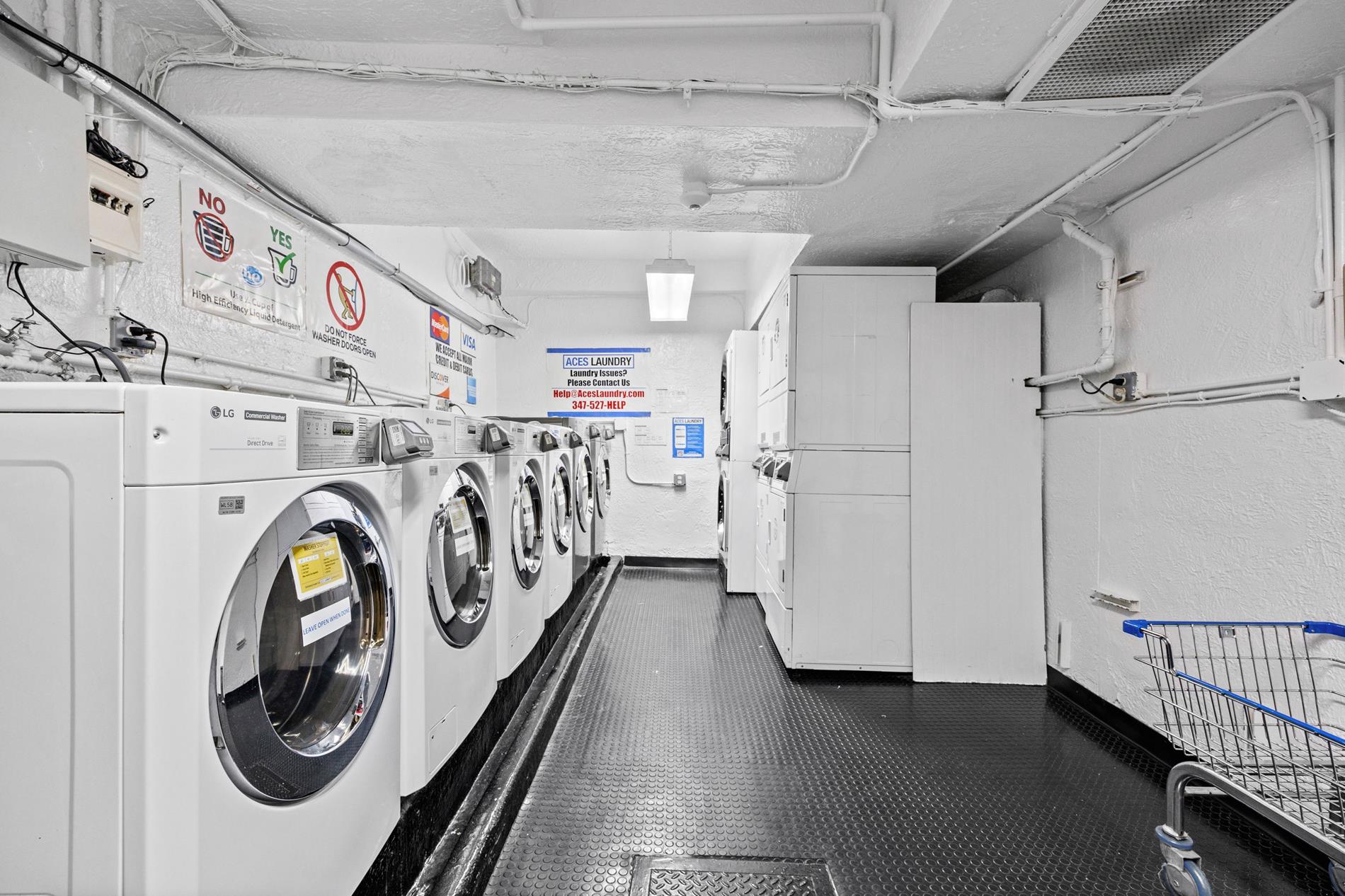 9411 Shore Road, Unit 1O Brooklyn, NY 11209 - Photo 7 of 19 a utility room with dryer and washer