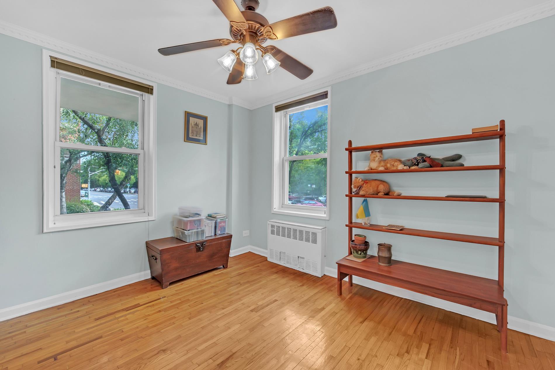 9411 Shore Road, Unit 1O Brooklyn, NY 11209 - Photo 9 of 18 a bedroom with furniture and a window