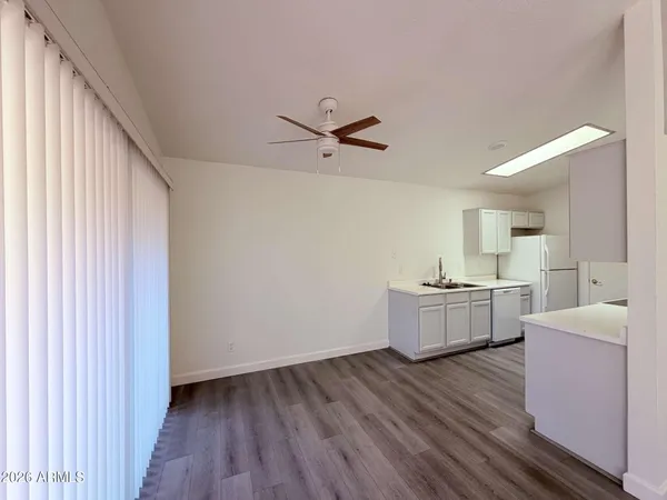 a view of kitchen with sink and wooden floor