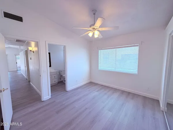 a view of a livingroom with wooden floor