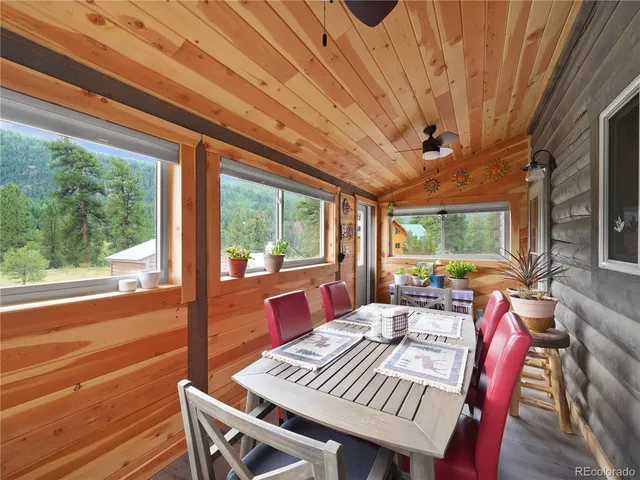 a outdoor dining space with furniture and outdoor view
