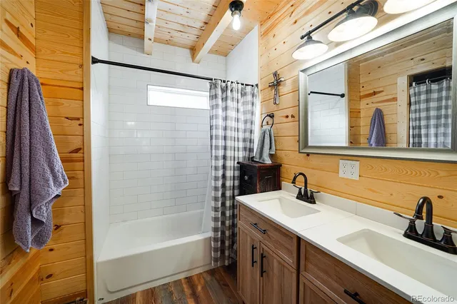 a bathroom with a washing machine and a sink