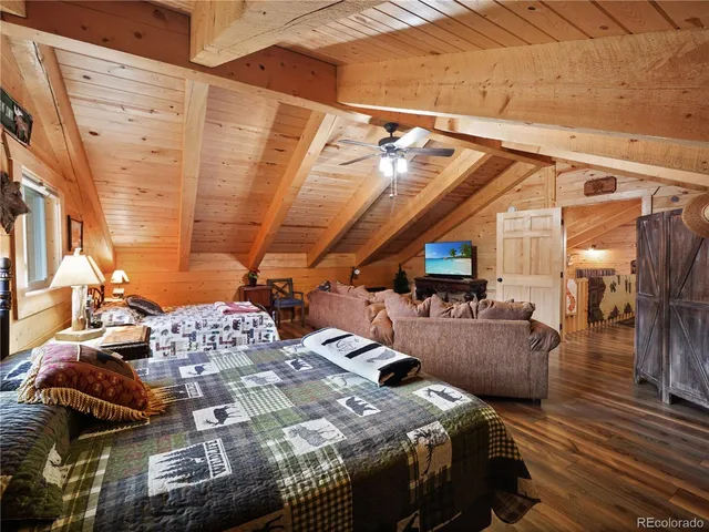 a bedroom with furniture and a lamp