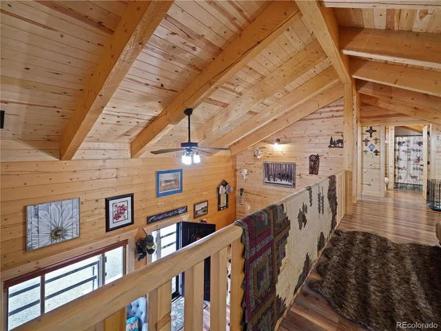 a view of a house with backyard porch and sitting area