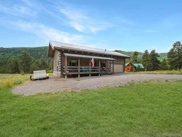 a view of a house with a big yard