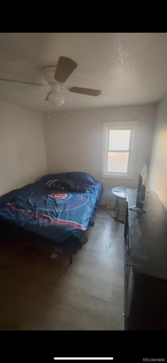1037 South Perry Street Denver, CO 80219 - Photo 11 of 13 a view of room with furniture and window