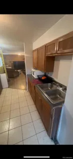 a kitchen with a sink and cabinets