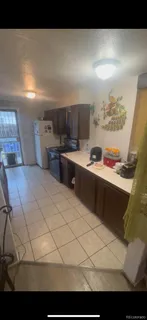 a kitchen with stainless steel appliances kitchen island granite countertop a sink and cabinets