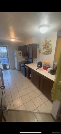 a kitchen with stainless steel appliances kitchen island granite countertop a sink and cabinets