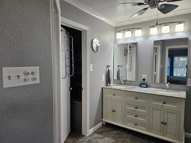 a bathroom with a double vanity sink and a mirror