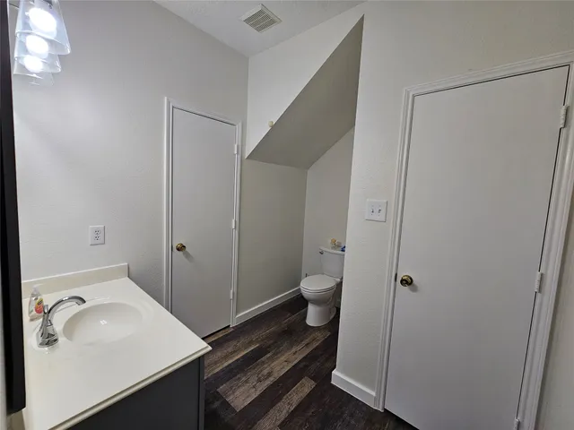 a bathroom with a sink and toilet