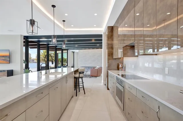 a spacious bedroom with a large bed couch and a window