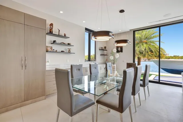 a view of a balcony with wooden chairs
