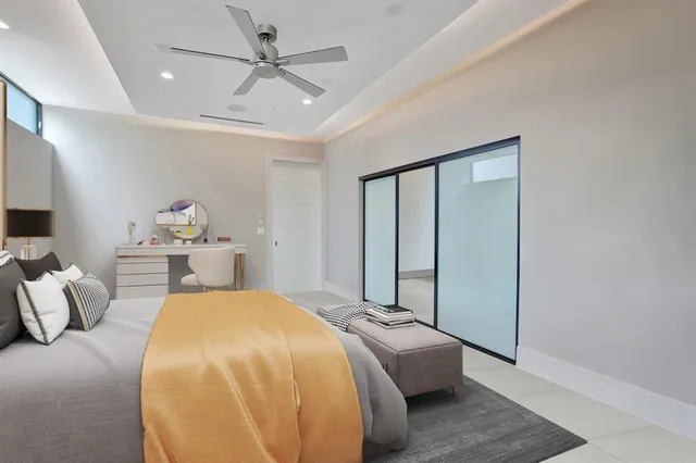 a view of a lake with tall buildings in the background