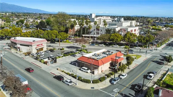 an aerial view of a city with parking