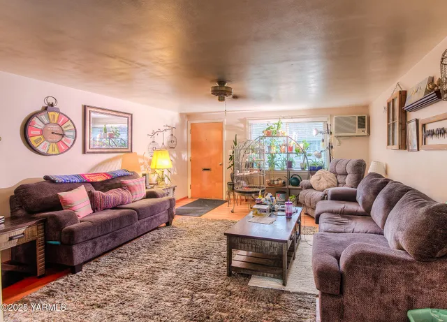 a living room with furniture and a window