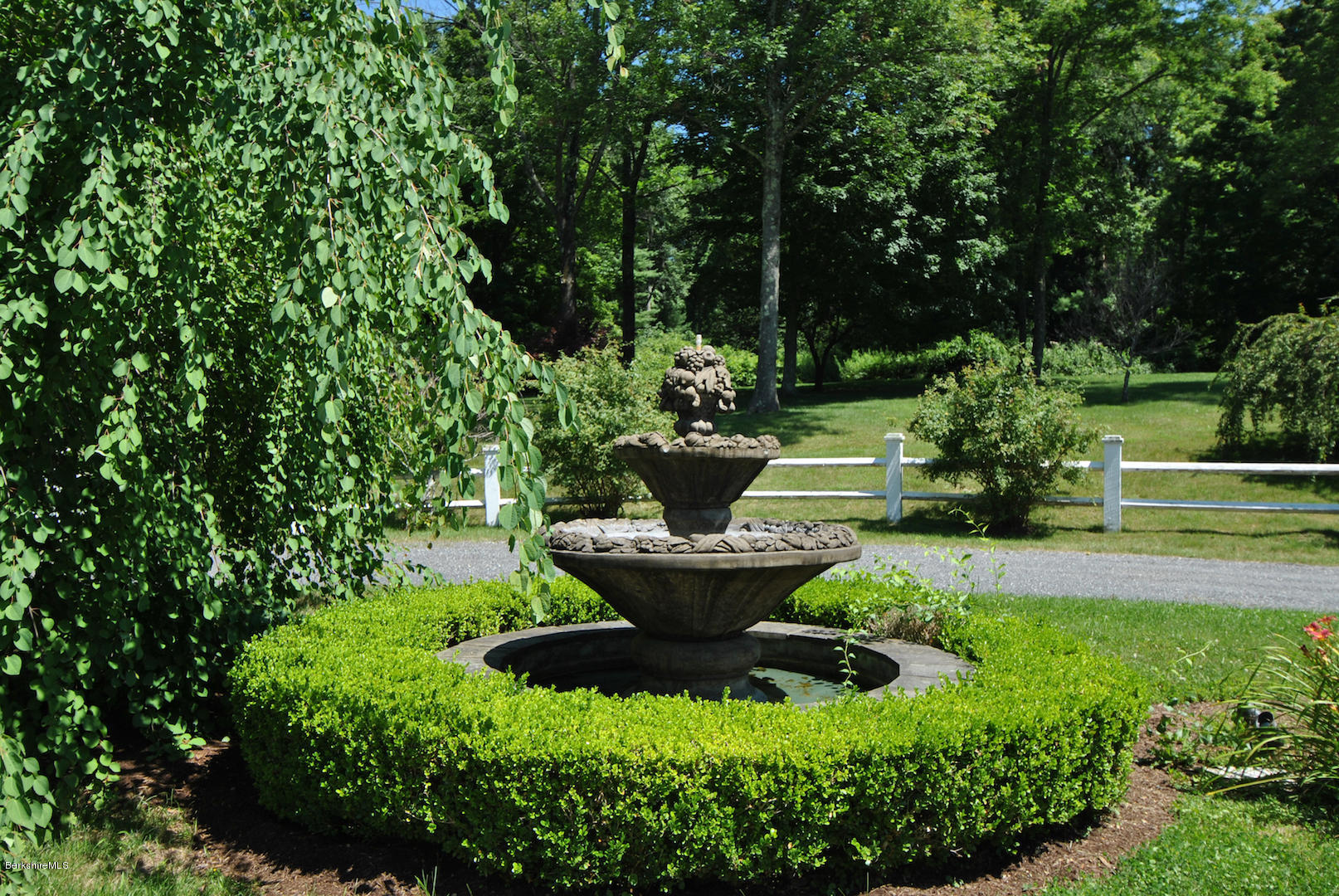 55 Maple Hill Road West Stockbridge, MA 01266 - Photo 14 of 63 a view of a garden with a fountain