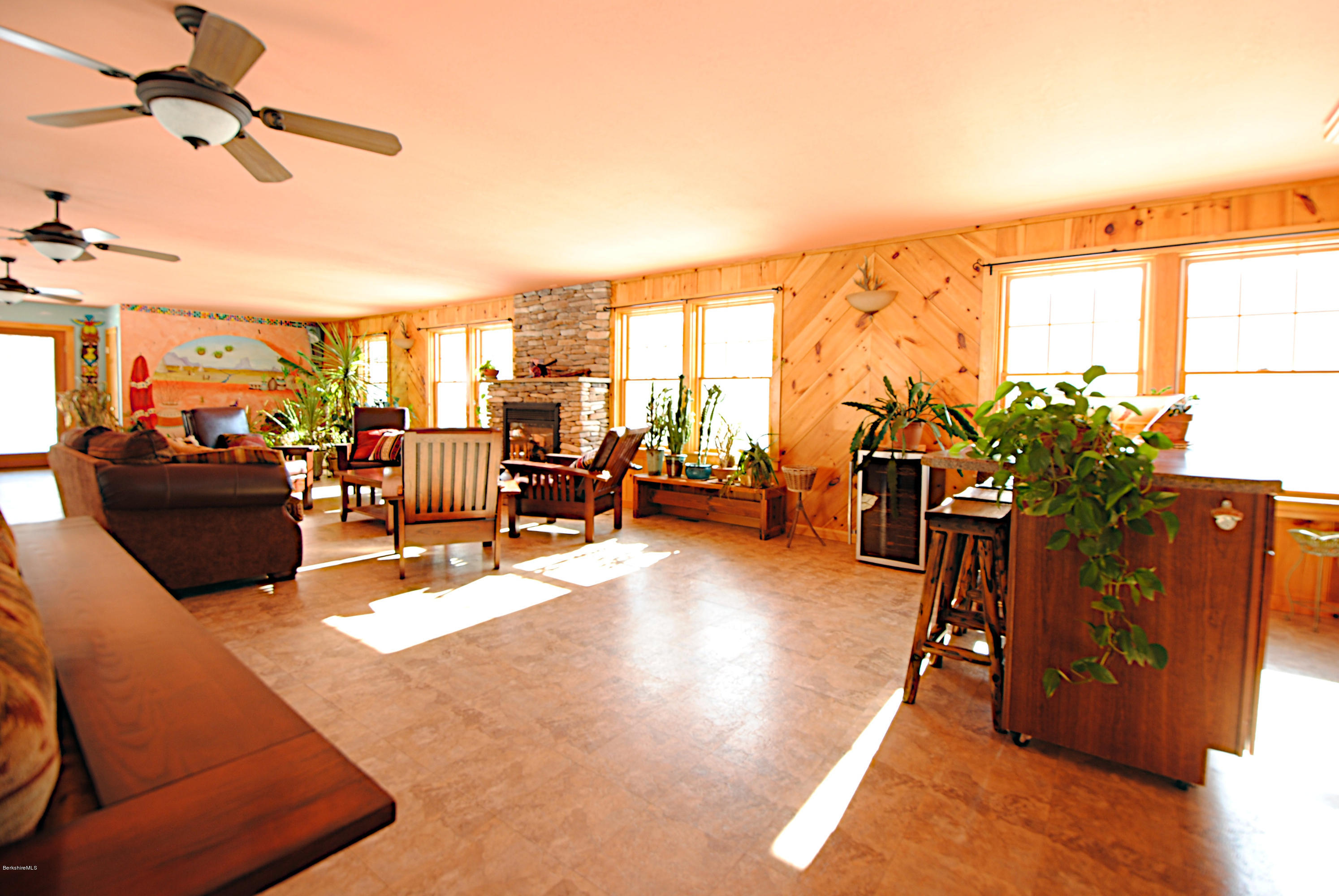 55 Maple Hill Road West Stockbridge, MA 01266 - Photo 32 of 63 a living room with furniture a rug kitchen view and a large window